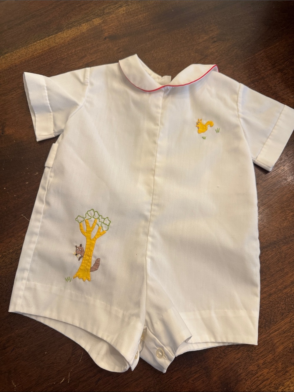 White vintage Short-Sleeve Kids One-Piece Jon-jon with tree and squirrel.